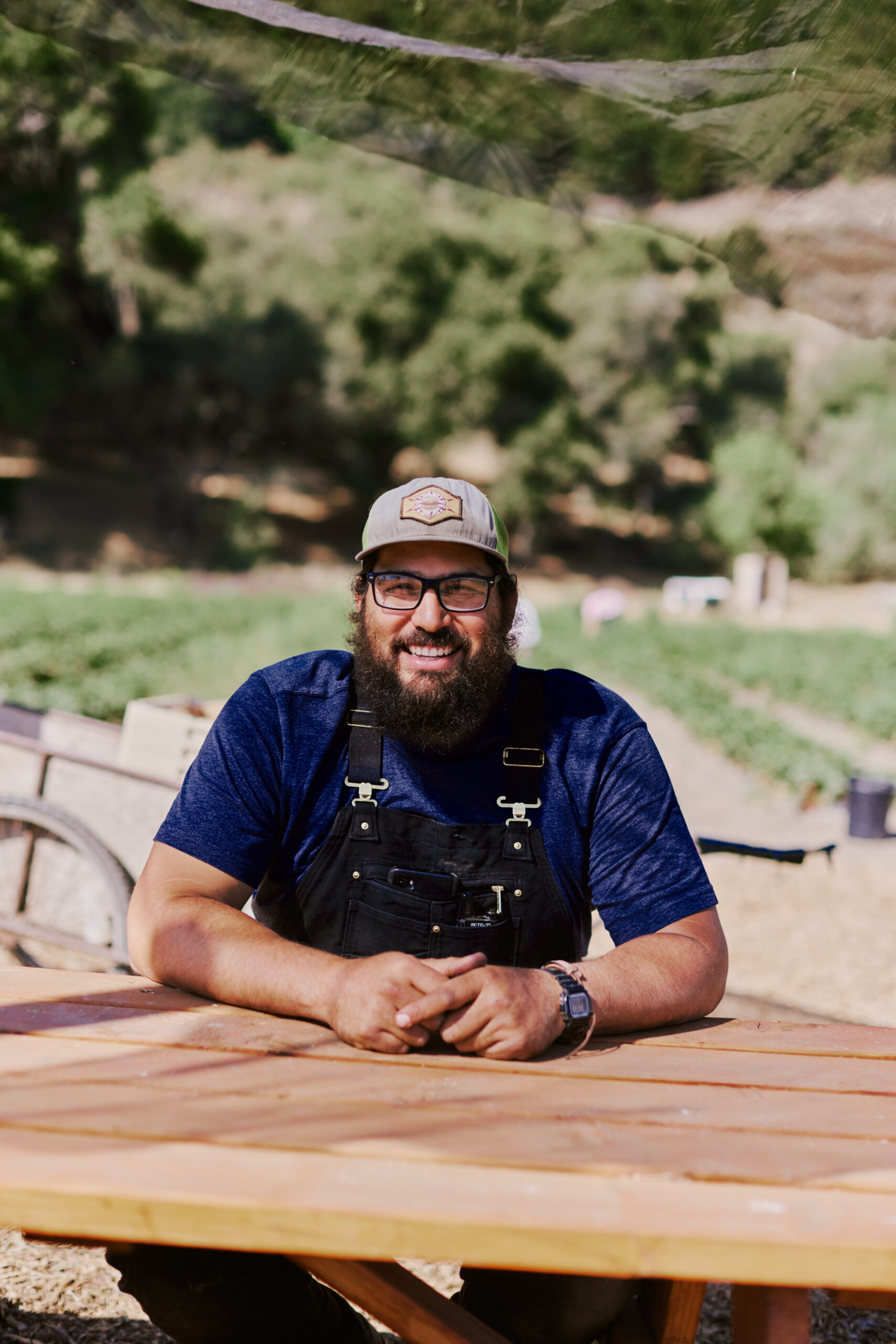 A man sitting and smiling for the camera
